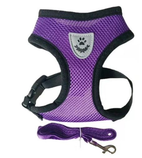 Orange and black reflective dog vest harness with high-visibility paw print emblem