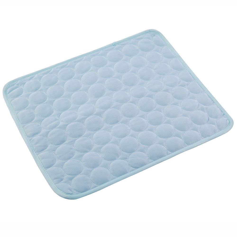 Golden Retriever puppy relaxing on a refreshing light blue non-toxic pet cooling mat